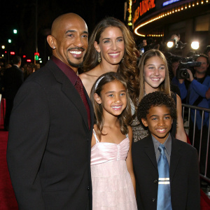 Montel Williams and Grace Morley with their children and grandchildren. Walking on red carpet. Hollywood premiere of Pocahontas II. Happy faces, diverse family