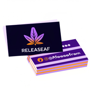 Black business cards for RELEASEAF. Logo features cannabis leaf design. Company name and contact information included. Modern, sleek design. Monochromatic color scheme with dark grey background.