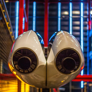 A futuristic MV Agusta F4 exhaust design. Shiny white with black accents. Sleek and aerodynamic. Photo of the sleek exhaust in a studio setting with a dark background.