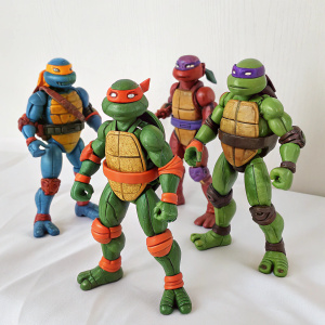Vintage Teenage Mutant Ninja Turtles action figures. White backdrop. Michelangelo in orange bandana, Leonardo in blue, Raphael in red, Donatello in purple. Each in distinctive dynamic poses, full of intricate details and colors.