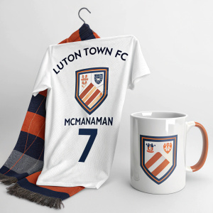 Modern digital art featuring Luton Town FC merchandise. White coffee mug, player McManaman #7, team scarf. Clean, sporty design with club branding.