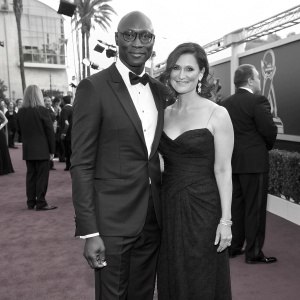 Lance Reddick and Stephanie Reddick at the star-studded Saturn Awards. Black and white themed gala.