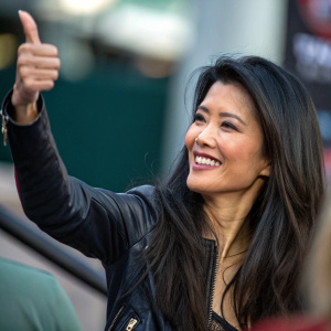 Kelly Hu giving a thumbs up to a fan's post. Featured image of woman with long dark hair.