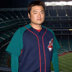 Shin-Soo Choo, professional baseball player, Cleveland Indians uniform, focused expression, indoor stadium, red accents, posing for a photo.