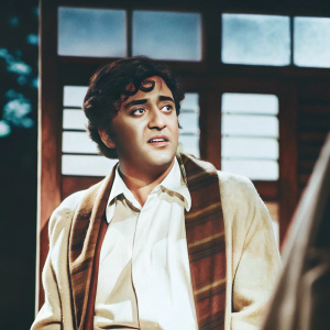 Digital painting of Kishore Kumar, Indian music icon. Blue backdrop, sketchy style, focus on face and upper body. Classic film poster mood.