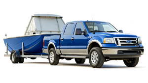 Blue pickup and boat trailer realistic detail photography 
