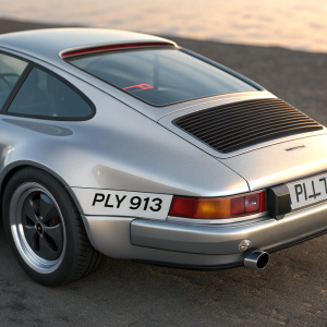 A silver Porsche 911, with California license plate PLY 913, highlighted in a detailed 3D rendering. Focus on rear view showcasing sleek design and unique tail section.