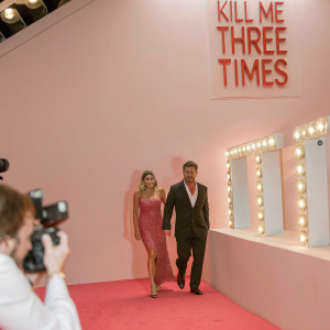 Luke Hemsworth and Samantha Hemsworth attend the New York City premiere of 'Kill Me Three Times'. Red carpet event with flashing cameras.