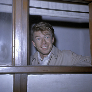 Vintage black and white photograph of Jochen Brockmann. German actor, 1960s era. Friendly smile.