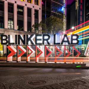 Digital marketing logo for Blinker Lab. Modern, sleek design featuring bold 'BLINKER LAB' text against a vibrant, colorful urban backdrop. Emphasis on bold typography and contemporary graphic elements.