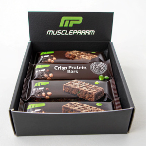 Multiple MusclePharm Crisp Protein Bars in the box. Chocolate flavor, black packaging with product images and text.