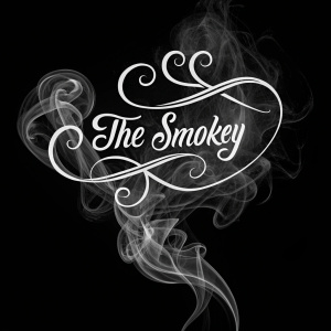 Cursive 'The Smokey Room' logo, with intricate smoke design, on a plain black background.
