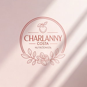 Charlanny Costa's wellness brand logo. A minimalist design featuring pastel hues of pink and white. The word 'Nutricionista' is subtly integrated below the logo, creating a light and airy feel with soft shadows.