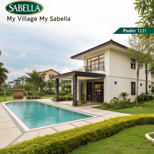 Promotional image for Sabella My Village My Sabella, a residential project in Gen Trias City, Cavite, Philippines. The scene features a modern villa with a swimming pool and garden area. The background showcases lush greenery. The ad includes the Sabella logo, a quote from Psalm 133:1, and highlights of the community amenities.