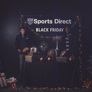 Sports Direct's festive window display featuring football-themed Black Friday deals.