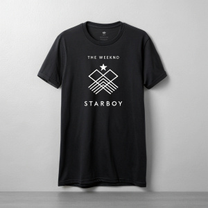 The Weeknd's black graphic tee, featuring the 'STARBOY' logo. The design is a modern abstract structure in white and black. Against a plain grey backdrop, this product photo captures the sleek simplicity.