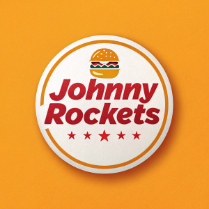 Johnny Rockets logo, a round emblem with bold red text 'Johnny Rockets' in a playful font. The logo incorporates a burger icon and is set against a bright orange background, creating a cheerful and inviting image.