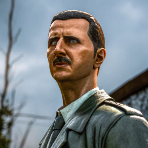 High-resolution image of President Bashar al-Assad, serious expression, mustache, cropped hair, blurred backdrop