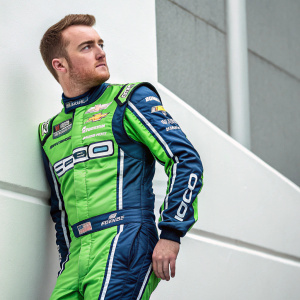 Ty Dillon, the NASCAR driver, in a sleek racing outfit. Vibrant green and blue sponsor logos. Behind him, a simple, uncluttered backdrop.