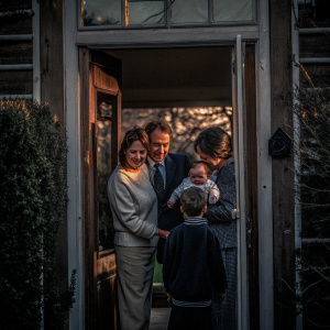 Tony Blair and his family gathered outside a rural cottage. Cherie Blair, Nicholas, Kathryn, Euan, and their newborn baby. Family outing.