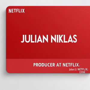 A sleek, minimalist business card for Julian Niklas. Bright red background with the Netflix logo at top left. Name 'Julian Niklas' in bold white font below logo. Contact details: 'Producer at Netflix' and 'julian@netflix.com' in crisp white text at bottom.