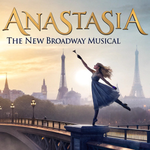 Promotional poster for 'Anastasia: The New Broadway Musical'. A ballerina with flowing blonde hair dancing on a bridge above a Parisian cityscape. Title 'Anastasia' in elegant font above.