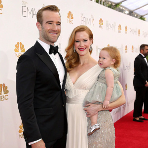 James Van Der Beek, Emilia Van Der Beek, Olivia Van Der Beek, and Kimberly Brook attending a glamorous awards show. James holds a baby. White backdrop with corporate logos.