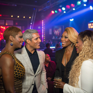 NeNe Leakes, Somaya Reece, Andy Cohen, and Lady Luck gathered for a lively discussion at a trendy nightclub.