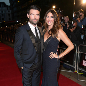 Dave Berry and Lisa Snowdon attending a high-profile music industry gala. They are posing confidently on the red carpet.