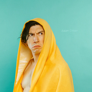 Close-up of Adam Driver as Kylo Ren, intense expression, black hair. Gray studio backdrop, artist's signature visible