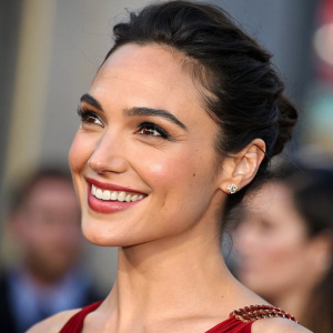 Gal Gadot's dual close-up portrait. Both images focus on her radiant smile. The background is blurred, highlighting her features.