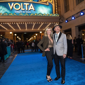 Debbie Gibson and Rutledge Taylor on the vibrant blue carpet, celebrating the launch of 'Volta' by Cirque du Soleil.