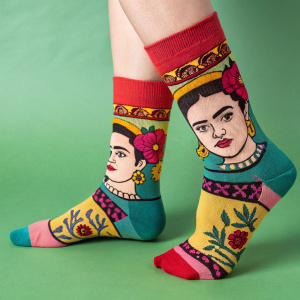 Frida Kahlo inspired socks. Green background. Vibrant colors. Whimsical face design. Snug fitting with cuff detail.