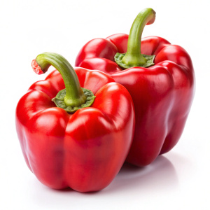 Two Colored red bell peppers on white background
