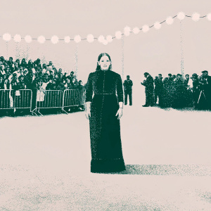 Jemima Kirke, in a black velvet dress, at a bustling film festival. Crowd and flashing cameras in the background.