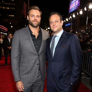 Chris Long and Vince Vaughn attending a DIRECTV NOW gala. Red carpet event, both in sharp suits.