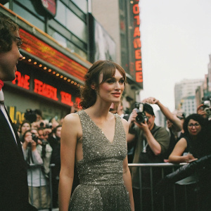 Keira Knightley at a bustling film festival. Wearing a silver sequined dress. Surrounded by paparazzi and event goers. Background features vibrant neon signs and bustling crowds.