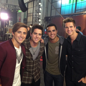 Kendall Schmidt, Logan Henderson, Carlos Pena Jr., and James Maslow from Big Time Rush on the set of their music video.