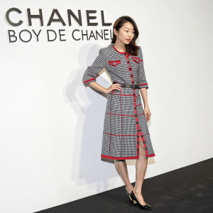 Ahn So-Hee at the Chanel Boy de Chanel launch event. She sports a stylish gray and red plaid dress. Against a plain white background with the brand's logo prominently displayed