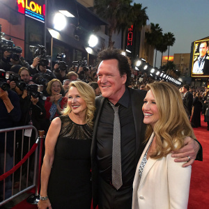 Virginia, Elaine, Michael Madsen, and Deanna Morgan at a Hollywood gala. The red carpet event is bustling with paparazzi and fans.
