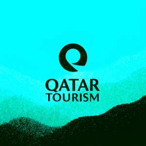 Elegant Qatar Tourism logo. Dark maroon symbol and modern text. Simple, sleek design.