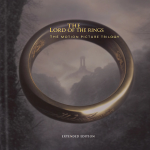 DVD cover art for 'The Lord of the Rings: The Motion Picture Trilogy' extended edition. A large golden ring with elvish script is prominently displayed. The title 'The Lord of the Rings' appears at the top, while 'Extended Edition' is written below.