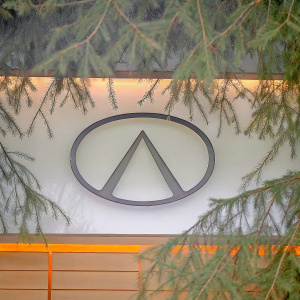 Modern logo design of Infiniti. Oval shape, minimalist with sleek appearance. Against a white backdrop.