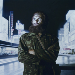 Attila the Hun, depicted in a modern art painting. Muscular, wild beard, and intense gaze. He is dressed in a contemporary camouflage uniform. Vibrant and chaotic urban backdrop.