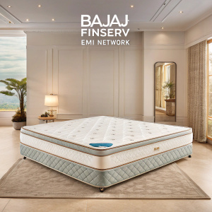 Advertisement for Bajaj Finserv EMI Network featuring a luxurious mattress. Soft hues and subtle lines create a serene, inviting atmosphere.