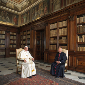 Formal portrait. Pope Francis and Antoni Marti at the Vatican library. Rich wood-paneled walls with towering bookshelves behind them