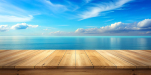 Wooden table top on blue sea