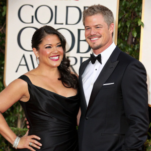 Eric Dane and Sara Ramirez attending the Golden Globe Awards. Sara in a black satin dress and Eric in a tuxedo.