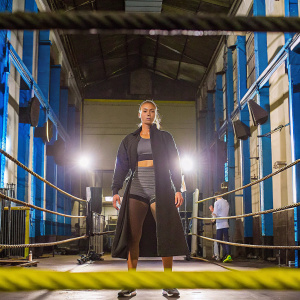 Maria Sharapova, in her custom Nike gear, graces the cover of Sports Illustrated. Background, an indoor gym with blue walls and spotlights