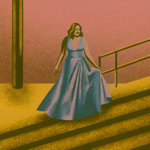 Sasha Alexander at the Critics' Choice Awards, elegant in a deep blue satin gown. Her face lights up with a radiant smile.